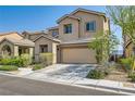 Charming two-story home featuring desert landscaping, covered entry, and attached two-car garage at 7900 Eastern Elk St, Las Vegas, NV 89149
