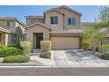 Charming two-story home featuring desert landscaping, covered entry, and attached two-car garage at 7900 Eastern Elk St, Las Vegas, NV 89149