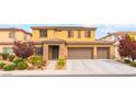 Inviting two-story home with well-maintained desert landscaping and a convenient three-car garage at 8112 Sapphire Sea St, North Las Vegas, NV 89085