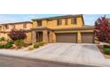 Attractive home boasting desert landscaping and a spacious three-car garage, offering ample parking at 8112 Sapphire Sea St, North Las Vegas, NV 89085