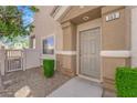 Inviting front entrance with well-maintained landscaping and pathway to the front door at 8658 Tom Noon Ave # 103, Las Vegas, NV 89178