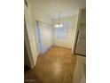 Cozy dining area with tile flooring and a charming chandelier at 9050 W Warm Springs Rd # 1123, Las Vegas, NV 89148