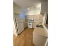 Functional kitchen features white appliances and ample cabinet space, ready for culinary creations at 9050 W Warm Springs Rd # 1123, Las Vegas, NV 89148