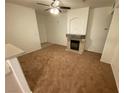 Cozy living room with a fireplace and an arched alcove at 9050 W Warm Springs Rd # 1123, Las Vegas, NV 89148