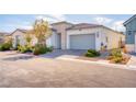 Charming single-story home with desert landscaping, a two-car garage, and a modern stucco facade at 9057 N Skye Treeline St, Las Vegas, NV 89166