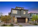 Charming two-story home featuring stone accents, a two-car garage, and a beautifully landscaped front yard at 2367 Ridgeline Wash St, Las Vegas, NV 89138
