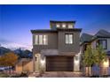 Charming two-story home featuring stone accents, a two-car garage, and a beautifully landscaped front yard at 2367 Ridgeline Wash St, Las Vegas, NV 89138