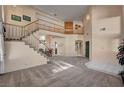 Bright living room featuring a staircase, high ceilings, and an open floor plan at 2636 Ontario Dr, Las Vegas, NV 89128
