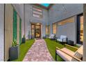 Inviting courtyard with lush plants, string lights, and cozy seating, perfect for outdoor relaxation at 365 Crown Mesa Ave, Las Vegas, NV 89138