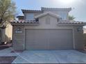 Spacious two-car garage with a modern design and a paved driveway at 4454 Bertram Ln, Las Vegas, NV 89147