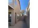 Side yard showcasing a private walkway and secure gated access to backyard at 4454 Bertram Ln, Las Vegas, NV 89147