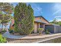 Well-maintained home featuring manicured greenery and a welcoming facade at 501 Starfire Pl, Las Vegas, NV 89107