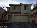 Two-story home featuring a spacious two-car garage and neutral stucco at 5213 Castle Butte Ct, North Las Vegas, NV 89031