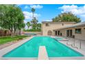 Outdoor pool with diving board, spa and covered patio in backyard of home at 5239 Somerset Dr, Las Vegas, NV 89120
