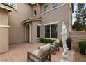 Cozy courtyard with brick flooring and seating area, perfect for enjoying quiet moments outdoors at 541 Green Sage Way, Las Vegas, NV 89138