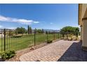 Enjoy golf course views from the stone patio in this beautiful backyard with wrought iron fence at 5524 E San Pietro Dr, Pahrump, NV 89061