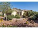 Attractive single-story home with desert landscaping and a brick-paved walkway leading to the front door at 5524 E San Pietro Dr, Pahrump, NV 89061