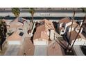 An aerial view of homes featuring well-maintained landscaping and tile roofs at 566 Searchlight Dr, Las Vegas, NV 89110
