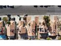 An aerial view of a neighborhood showcasing tile roofs, driveways, and landscaping at 566 Searchlight Dr, Las Vegas, NV 89110