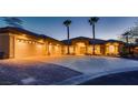 Beautiful front exterior view of the home with ample parking and desert landscaping at 7521 Prancing Pony Ct, Las Vegas, NV 89131