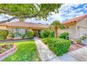 Attractive single story home features well maintained landscaping and quaint front walkway leading to the entry at 7533 Grenfell Dr, Las Vegas, NV 89129