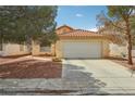 Charming single-story home with a well-maintained lawn and a spacious two-car garage at 9051 Sandy Slate Way, Las Vegas, NV 89123
