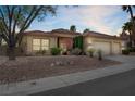 Beautiful single-story home featuring desert landscaping and a two-car garage at 10201 Los Padres Pl, Las Vegas, NV 89134