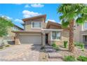 Stylish two-story home boasts desert landscaping, stone accents and a brick driveway at 10254 Kesington Dr, Las Vegas, NV 89135