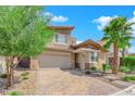 Inviting two-story home boasts desert landscaping, mature trees and a brick driveway at 10254 Kesington Dr, Las Vegas, NV 89135