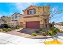 Charming two-story home with a two car garage, brick driveway and manicured landscaping at 10987 Kingston Fields Ave, Las Vegas, NV 89166