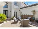 Charming courtyard with seating, stone accents, and lush greenery provides a relaxing outdoor space at 11 Caminito Amore, Henderson, NV 89011