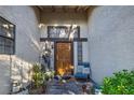 Close-up of the front door with sidelights and a decorative statue, offering a warm welcome at 146 Cascade Dr, Henderson, NV 89074