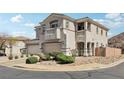 Charming two-story home with a three-car garage and well-maintained landscaping at 234 Priority Point St, Henderson, NV 89012