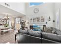 Bright living and dining area features high ceilings, fireplace, and comfortable seating at 234 Priority Point St, Henderson, NV 89012