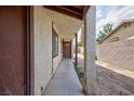 Exterior view of the front entry, featuring a covered walkway at 3939 Jontue St, Las Vegas, NV 89115