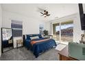 Comfortable bedroom with plush carpets, ample natural light, and access to a private balcony at 41 Strada Moscato, Henderson, NV 89011