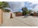 Spacious backyard patio with fountain, desert landscaping, and plenty of room for entertaining at 4216 Thunder Twice St, Las Vegas, NV 89129