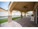 Spacious outdoor patio with brick pillars, ceiling fans and well manicured astroturf at 4440 Pacific Crest Ave, Las Vegas, NV 89115