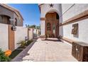 Inviting entrance featuring a landscaped walkway and decorative elements leading to the front door at 5325 Sandstone Dr, Las Vegas, NV 89142