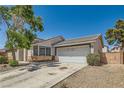 Attractive single-story home boasting a two-car garage and easy desert landscaping at 5353 Dandelion Ct, North Las Vegas, NV 89031