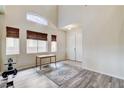Inviting entryway boasting tile and hardwood flooring and bathed in natural light at 5588 Holcomb Bridge Ct, Las Vegas, NV 89149