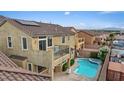 Backyard featuring a private pool, jacuzzi, patio, and solar panels on the roof at 640 Finch Island Ave, Henderson, NV 89015