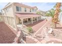 Expansive backyard with covered patio, perfect for outdoor entertaining and relaxation at 6630 Cave Rock Ave, Las Vegas, NV 89110