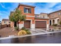 Charming two-story home featuring a two car garage and lovely front yard landscaping at 817 Great Sky Ct, North Las Vegas, NV 89084