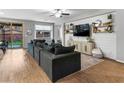 Bright living room with a large comfortable couch, hardwood floors and lots of natural light at 817 Great Sky Ct, North Las Vegas, NV 89084