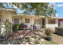 Inviting front porch with brick flooring, comfortable seating, and a cozy, welcoming atmosphere at 1041 E Saint Louis Ave, Las Vegas, NV 89104