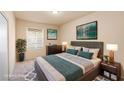 Cozy bedroom with a queen-sized bed, soft lighting, and stylish decor for a relaxing ambiance at 10550 W Alexander Rd # 2017, Las Vegas, NV 89129