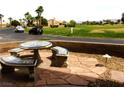 Stone tiled backyard patio set with a serene view of the neighborhood at 1160 Golf Club, Laughlin, NV 89029