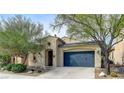 Charming single story home with well maintained landscaping, stucco, and a blue garage door at 1264 Olivia Pkwy, Henderson, NV 89011