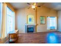 Bright living room features a fireplace, high ceilings and hardwood floors at 1309 Misty View Ct, North Las Vegas, NV 89031